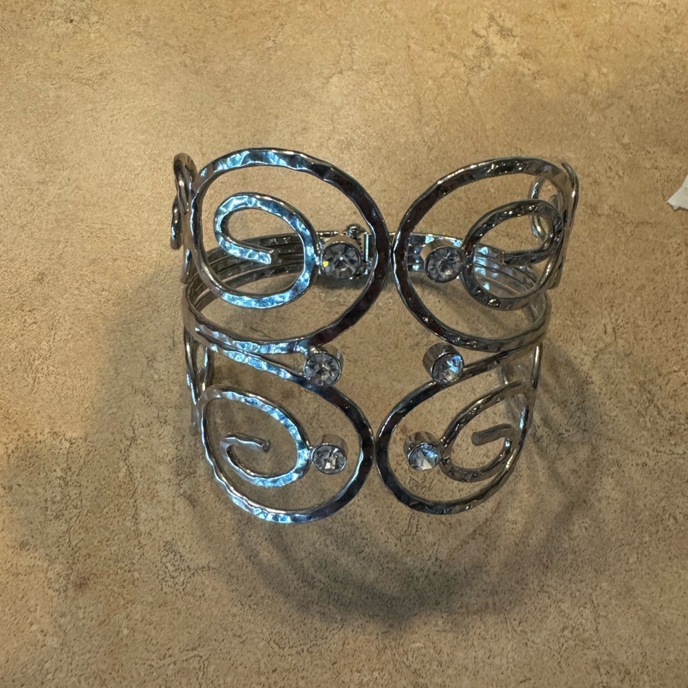 - Cuff bracelet with rhinestone accents